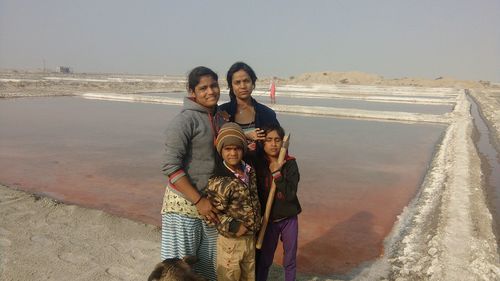 Portrait of smiling young couple on land