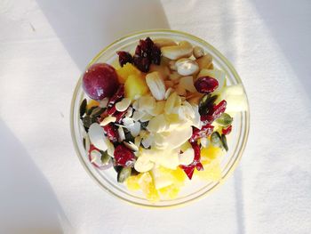 High angle view of chopped fruits in bowl on table