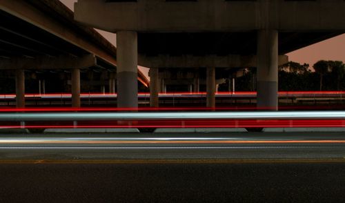 Light trails on road in city at night