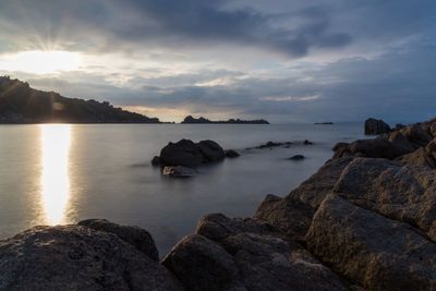 Scenic view of sea against sky at sunset