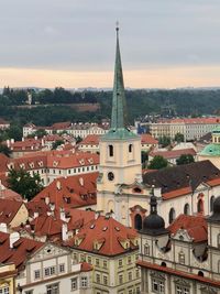 High angle view of buildings in town against sky