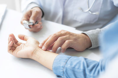 Close-up of man holding hands