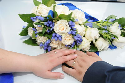 Close-up of hand holding flower