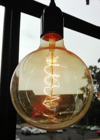 Close-up of illuminated light bulb