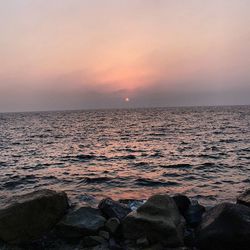 Scenic view of sea at sunset