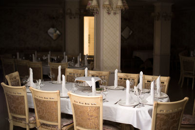 Close-up of chairs and tables in restaurant