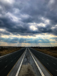 Road against cloudy sky during sunset