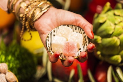 Close-up of hand holding fruit