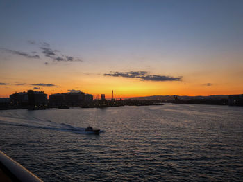 Scenic view of buildings against sky during sunset