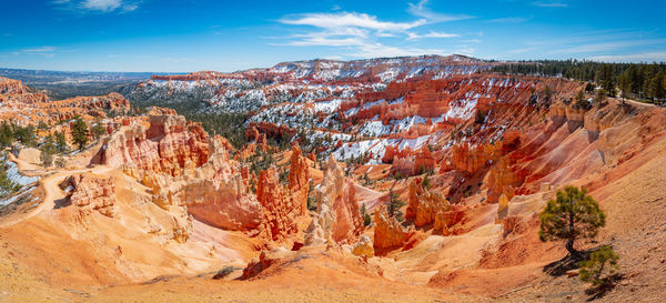 Rock formations on landscape against sky