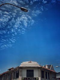 Low angle view of building against blue sky