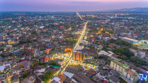 High angle view of illuminated cityscape at night