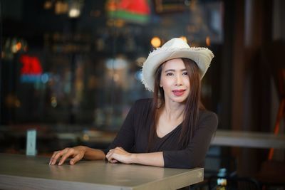 Portrait of woman sitting at restaurant