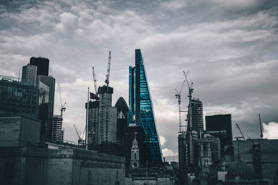 View of factory against cloudy sky