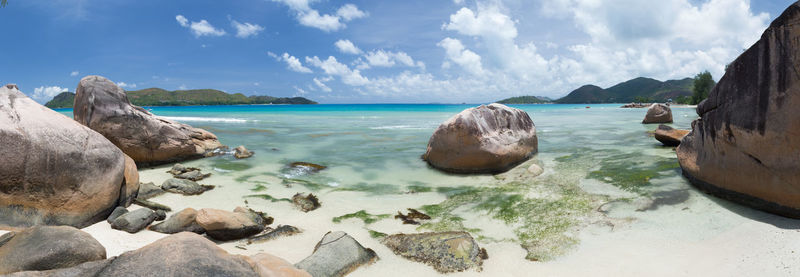 Panoramic shot of sea shore against sky