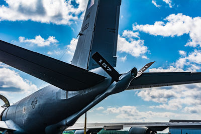 Low angle view of airplane flying against sky