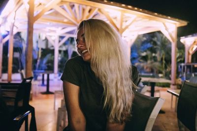 Woman looking away while sitting at restaurant