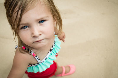 Close-up portrait of cute girl at beach