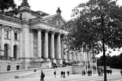 Tourists in front of historical building