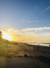 Scenic view of beach against sky during sunset