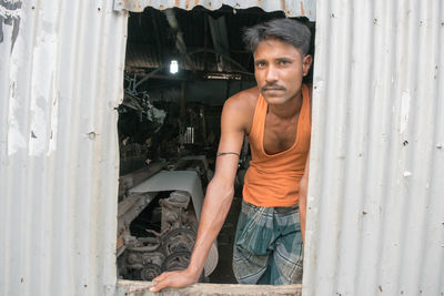 Portrait of mid adult man at workshop