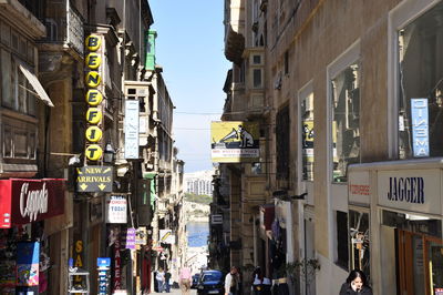 Street in city against sky