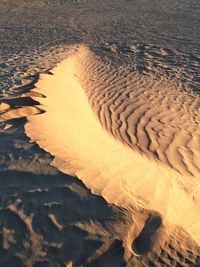 High angle view of sand dunes at beach