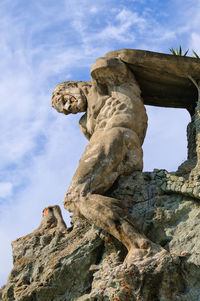 Low angle view of statue against sky