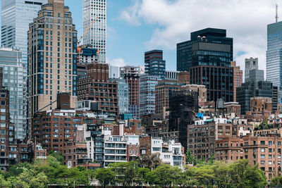 Modern buildings in city against sky