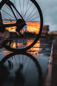 Close-up of bicycle wheel against sky