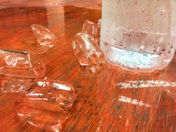 Close-up of frozen glass on table