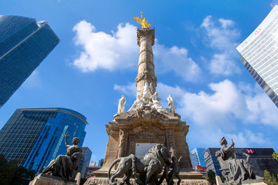 Low angle view of statue against cloudy sky