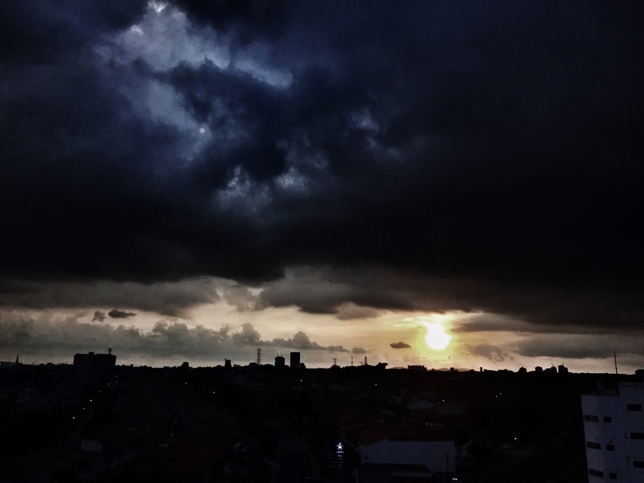 sky, sunset, building exterior, cloud - sky, architecture, built structure, silhouette, cloudy, city, weather, cityscape, cloud, residential building, residential structure, dramatic sky, overcast, nature, scenics, beauty in nature, dusk