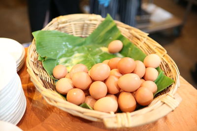 Close-up of eggs in basket on table