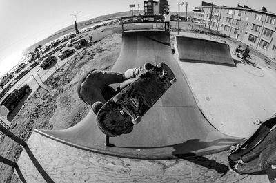 Fish-eye view of person skateboarding