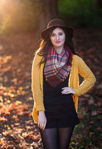 Portrait of a smiling young woman standing outdoors