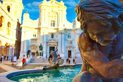 Statue of swimming pool in building