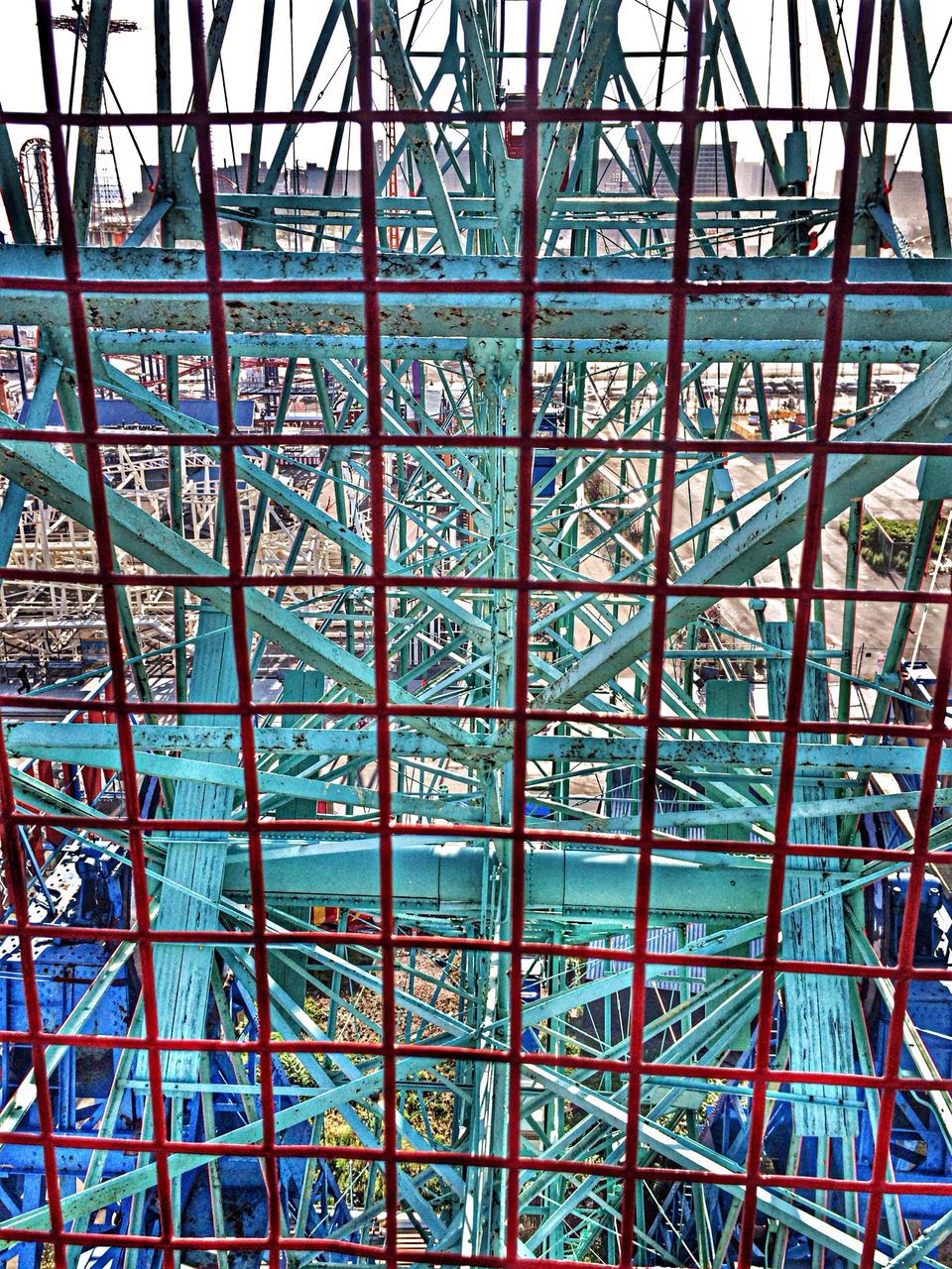 pattern, low angle view, indoors, full frame, architecture, built structure, design, ceiling, backgrounds, architectural feature, famous place, metal, glass - material, grid, international landmark, travel destinations, directly below, travel, no people, tourism