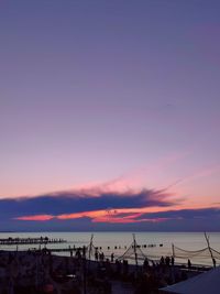 Sailboats in marina at sunset