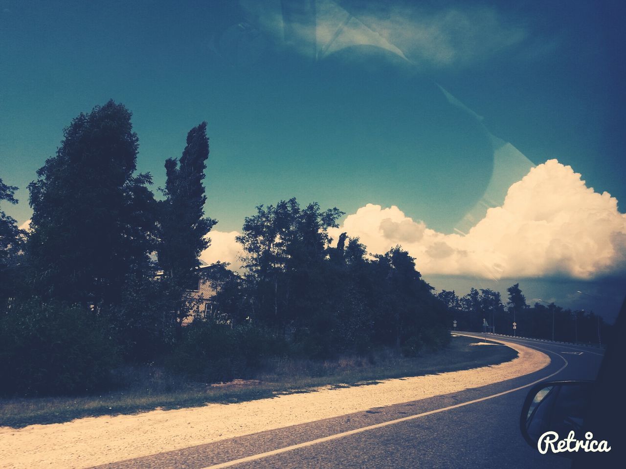 transportation, road, road marking, sky, tree, the way forward, street, car, cloud - sky, cloud, blue, diminishing perspective, country road, sunlight, nature, outdoors, vanishing point, no people, land vehicle, asphalt