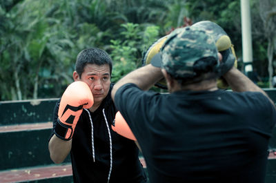 Man practicing boxing outdoors