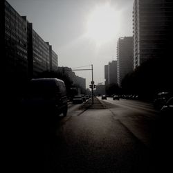 View of city street at sunset