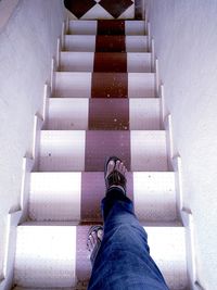 Low section of person standing on steps