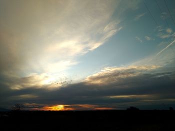 Low angle view of silhouette landscape against sky during sunset