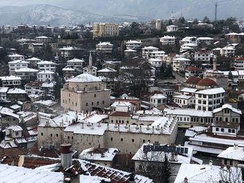 High angle view of buildings in city during winter