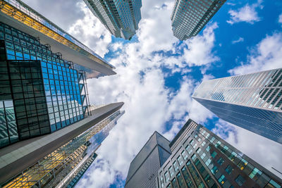 Low angle view of modern buildings against sky