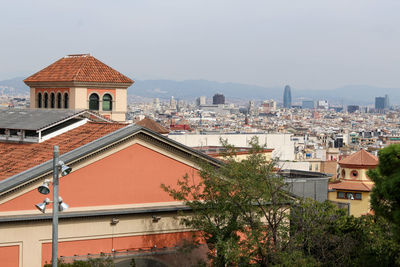 High angle view of houses and buildings against clear sky