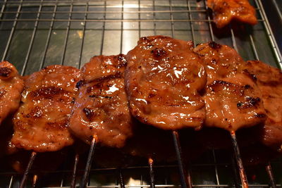 Close-up of meat on barbecue grill