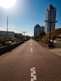 Street amidst buildings against sky