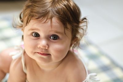 Portrait of cute baby girl at home